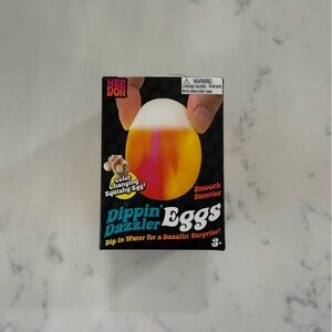 Dippin' Dazzler Eggs- NeeDoh color changing egg- in the color Smooth sunrise.